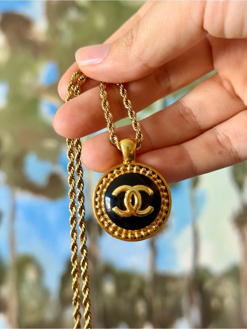 CHANEL Gold and Black Round CC Medallion Necklace